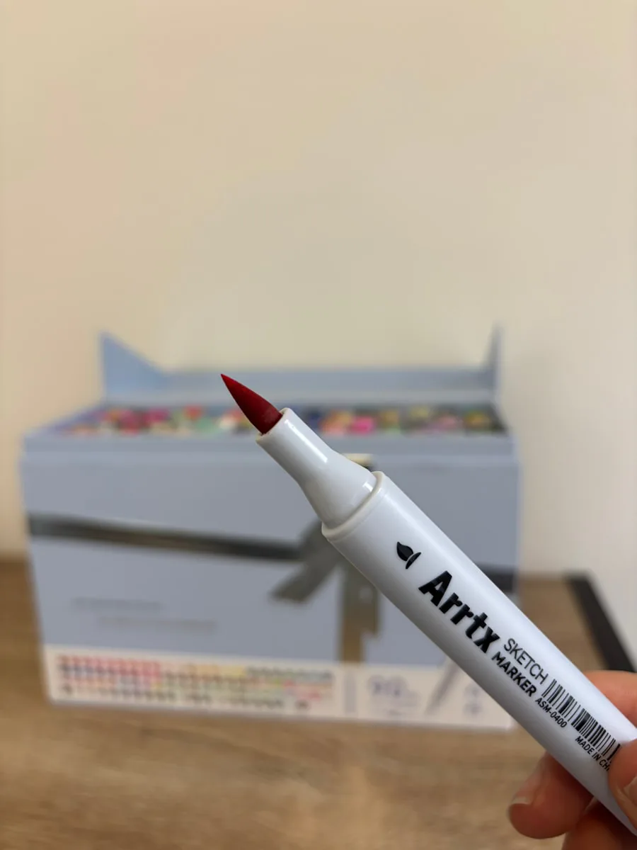 Close-up of an Arrtx brush tip with the storage box in the background