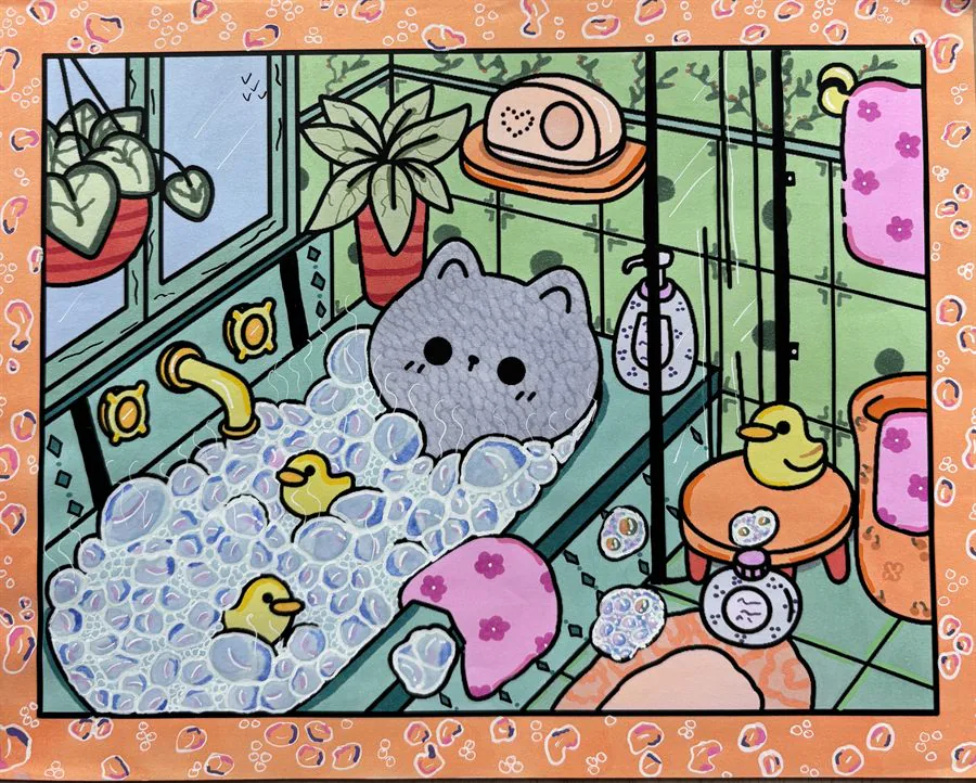 Cute cat in a bubble bath with small ducks